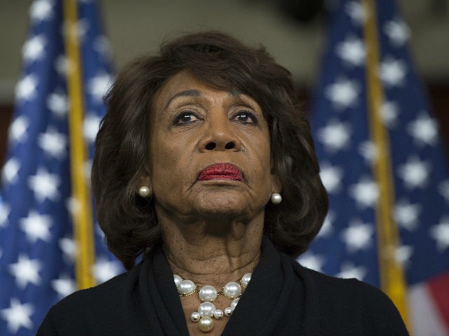 US Representative Maxine Waters (D-CA) looks on before speaking to reports regarding the R