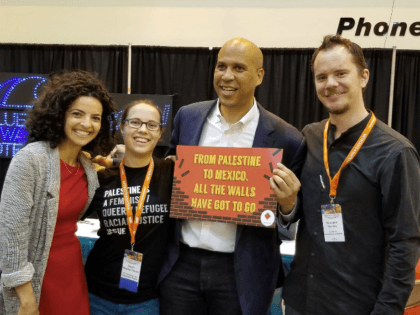 TEL AVIV – New Jersey senator Cory Booker, a possible contender for the 2020 Democratic presidential nomination, was photographed on Friday appearing to endorse a pro-Palestinian movement by holding a sign calling for the removal of the security fence in Israel.