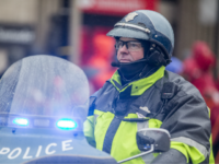 police boston A State Police Officer checks the permiter of the race course during a rain storm at the 24 mile marker of the 2018 Boston Marathon on April 16, 2018 in Brookline, Massachusetts. Desiree Linden became the first American woman to win since 1985 with an unofficial time of 2:39:54. Yuki …