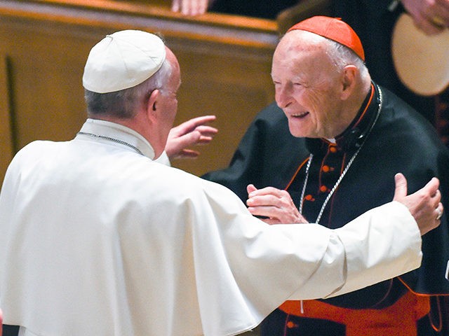 FILE - In this Sept. 23, 2015 file photo, Pope Francis reaches out to hug Cardinal Archbis