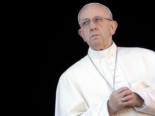 Pope Francis joins his hands during the Urbi et Orbi (Latin for ' to the city and to the world' ) Christmas' day blessing from the main balcony of St. Peter's Basilica at the Vatican, Monday, Dec. 25, 2017. (AP Photo/Alessandra Tarantino)