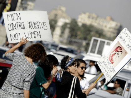 In this June 14, 2014 file photo, Egyptian women hold banners during a protest against sexual harassment in Cairo, Egypt. Accusations of sexual misconduct directed at two prominent human rights lawyers in Egypt -- one of them a former presidential hopeful -- have roiled the country's beleaguered civil society, which …