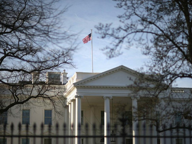 WASHINGTON, DC - MARCH 18: Morning sunlight strikes the flag flying above the White House March 18, 2015 in Washington, DC. The U.S. Secret Service said a letter sent to the White House tested positive for cyanide at an off-site mail screening facility Tuesday. (Photo by Chip Somodevilla/Getty Images)