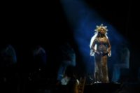 Beyonce, pictured here performing while pregnant in February 2017, has said she had needed a month of bed rest after giving birth to her twins in June that year, and that her health had been at risk before undergoing an emergency C-section
