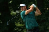 Brooks Koepka of the United States plays his shot from the 14th tee