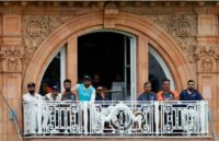 Not a pretty sight: India captain Virat Kohli (right) watches his team collapse to defeat at Lord's