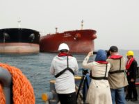 A picture taken on March 12, 2017, shows an Iranian tanker and a South Korean (R) tanker docking at the platform of the oil facility in the Khark Island on the shore of the Gulf A picture taken on March 12, 2017, shows an Iranian tanker and a South Korean (R) tanker docking at the platform of the oil facility in the Khark Island on the shore of the Gulf
