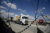 A truck carrying goods for Palestinians arrives at Kerem Shalom crossing in the southern Gaza Strip on August 15, 2018