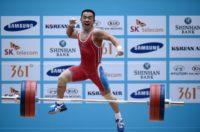 North Korea's Om Yun-Chol celebrates after breaking the world record in the men's 56kg weightlifting event during the 2014 Asian Games in Incheon