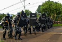 Police in the Brazilian state of Parana, seen here in riot gear at a political rally March 26, 2018, have dropped "masculinity" as an attribute required of new recruits