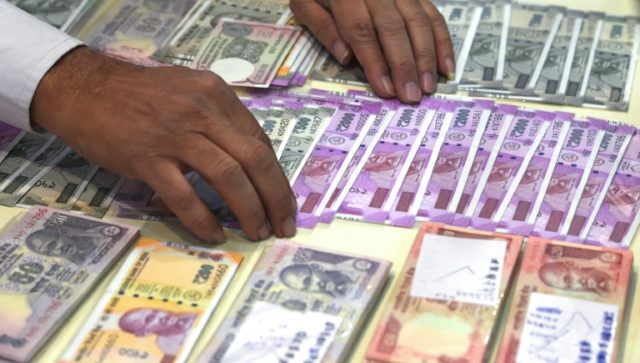 India's falling rupee a 'double-edged sword' for economy: analysts
