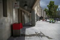 A "uritrottoir" public urinal stands on a Paris street near Gare de Lyon