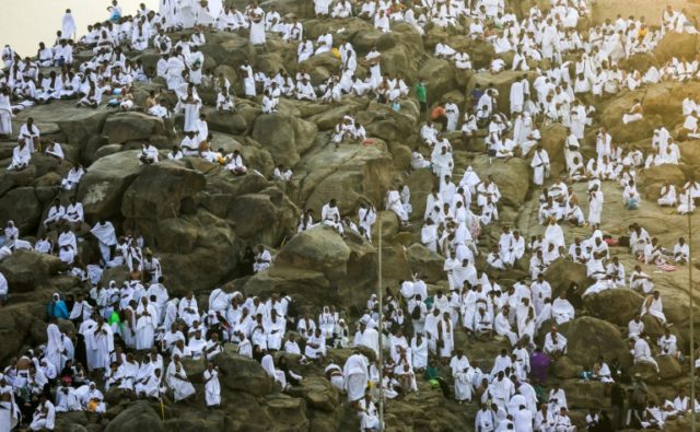 Muslim pilgrims scale Mount Arafat for peak of hajj