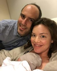 New Zealand's Minister for Women Julie Anne Genter and partner Peter Nunns with their new baby in Auckland City Hospital.Genter, a Green MP and keen cyclist, made global headlines when she cycled to hospital for the birth of her first baby