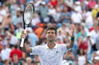 History man: Novak Djokovic celebrates his win over Roger Federer in Cincinnati
