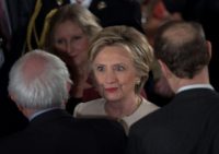 Ex-secretary of state Hillary Clinton greets Senator Bernie Sanders, her rival for the Democratic nomination, following Donald Trump's inauguration as president in 2017