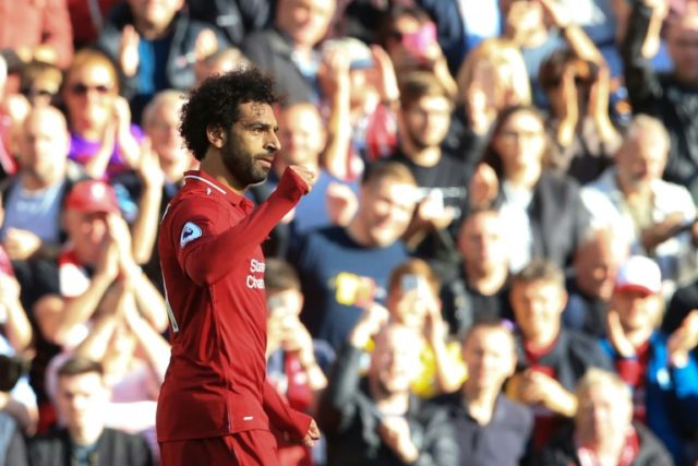 Salah strike beats Brighton to send Liverpool top