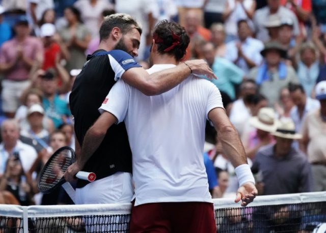 Federer, Djokovic through as storm rages over umpire's Kyrgios pep-talk