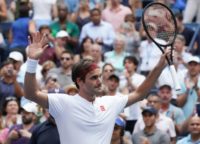 Victory salute: Roger Federer celebrates victory against Benoit Paire