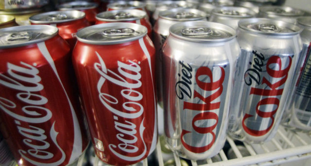Rising Consumer Prices In this March 17, 2011, file photo, cans of Coca Cola and Diet Coke sit in a cooler at a deli in Portland, Ore. Items ranging from canned beverages to airline tickets will likely get more expensive, companies warn, as they face higher costs. Procter & Gamble, one of the biggest makers of consumer products, said Tuesday, July 31, 2018, that Pampers prices will increase by an average of 4 percent in North America, while the Bounty, Charmin and Puffs brands could see 5 percent increases. (AP Photo, File) The Associated Press