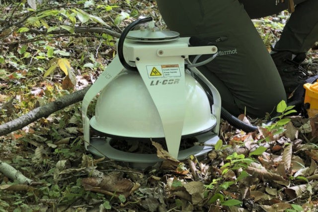 Warming Soil This May 3, 2018 photo provided by Benjamin Bond Lamberty shows a device measuring the amount of carbon dioxide released into the air from the soil at the Smithsonian Environmental Research Center near Edgewater, Md. Observations from across the globe show that as temperatures have warmed, bacteria and fungi in the soil are becoming more active. These turbo charged microbes are feeding on dead leaves and plants, releasing more heat trapping carbon dioxide into the air, according to a study in the Wednesday, Aug. 1, 2018 edition of the journal Nature. (Benjamin Bond Lamberty via AP) The Associated Press