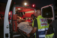 Israel Palestinians Injured person is taken to ambulance after a missile from Gaza Strip hit in the town of Sderot, Israel, Wednesday, Aug. 7, 2018. Sirens wailed in southern Israel warning of incoming projectiles from Gaza and Israeli media reported two people were lightly injured from shrapnel in the border town of Sderot. (AP photo/Yehuda Peretz) Israel hits Gaza after Palestinian rockets target Israel
