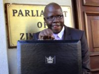 Zimbabwe Elections In this July, 18, 2012 file photo Tendai Biti, stands outside the Parliament Building in Harare, Zimbabwe. A Zimbabwean lawyer says that senior opposition official Tendai Biti has been arrested. Nqobizitha Mlilo, the lawyer, said Biti was arrested Wednesday, Aug. 8, 2018 while trying to cross into Zambia. (AP Photo/Tsvangirayi Mukwazh, File) In this July, 18, 2012 file photo Tendai Biti, stands outside the Parliament Building in Harare, Zimbabwe. A Zimbabwean lawyer says that senior opposition official Tendai Biti has been arrested. Nqobizitha Mlilo, the lawyer, said Biti was arrested Wednesday, Aug. 8, 2018 while trying to cross into Zambia. (AP Photo/Tsvangirayi …