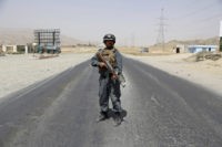 The Latest: Afghan officials: Taliban attack kills 30 troops