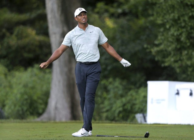 Northern Trust Golf Tiger Woods reacts to his shot on the fourth hole during the third round of the Northern Trust golf tournament, Saturday, Aug. 25, 2018, in Paramus, N.J. (AP Photo/Mel Evans) The Associated Press