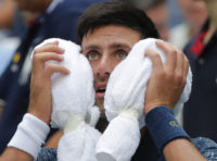 Djokovic turns to 'survival mode' to win at steamy US Open
