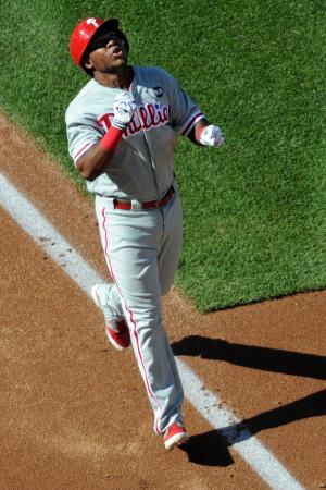 Philadelphia Phillies' Maikel Franco hits himself with bat flip after walk-off