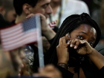 FILE - In this Nov. 8, 2016 file photo, a woman weeps as election results are reported dur