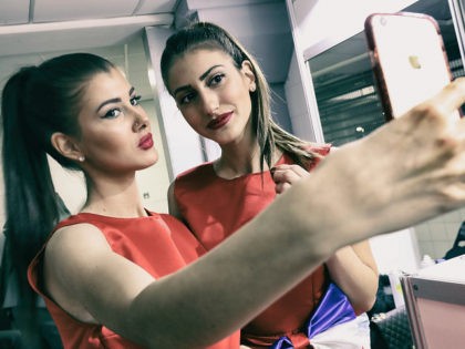 BELGRADE, SERBIA - MARCH 03: (Editors note: This image has had a digital filter applied to it) Presentation party girls pose for a 'selfie' ahead of a medal ceremony on day one of the 2017 European Athletics Indoor Championships at Kombank Arena on March 3, 2017 in Belgrade, Serbia. (Photo …
