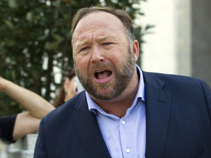 Conspiracy theorist Alex Jones speaks outside of the Dirksen building of Capitol Hill after listening to Facebook COO Sheryl Sandberg and Twitter CEO Jack Dorsey testify before the Senate Intelligence Committee on 'Foreign Influence Operations and Their Use of Social Media Platforms' on Capitol Hill, Wednesday, Sept. 5, 2018, in …