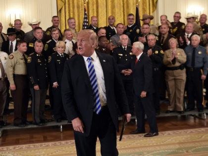 President Donald Trump responds to a reporters question during an event with sheriffs in t
