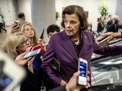 Sen. Dianne Feinstein, D-Calif., speaks to reporters as she walks through the Senate Subwa