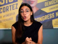 Democratic congressional candidate Alexandria Ocasio-Cortez talks with supporters during her general campaign kick-off rally on September 22, 2018 in the Bronx borough of New York. (Photo by Don EMMERT / AFP) (Photo credit should read DON EMMERT/AFP/Getty Images)