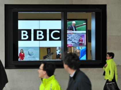 A BBC logo is pictured on a television screen inside the BBC's New Broadcasting House office in central London, on November 12, 2012. The BBC announced that two of its executives were standing aside on Monday and warned more heads may roll as it battles with a major crisis over …