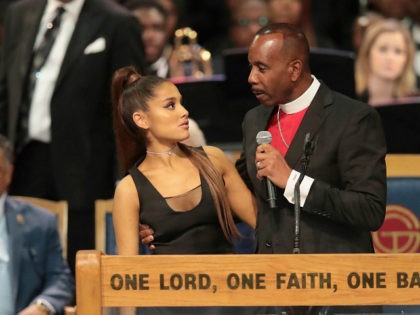 DETROIT, MI - AUGUST 31: Singer Ariana Grande speaks with Bishop Charles Ellis III after performing at the funeral for Aretha Franklin at the Greater Grace Temple on August 31, 2018 in Detroit, Michigan. Franklin died at the age of 76 at her home in Detroit on August 16. (Photo …