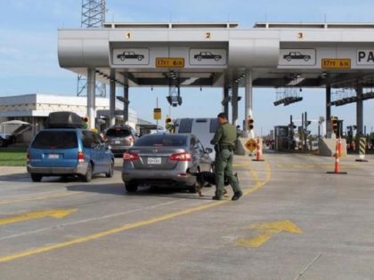 Border Patrol agents inspect cars at immigration checkpoint. (AP File Photo)