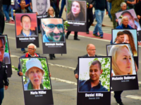 Demonstrators hold up placards showing portraits of victims of refugees during a protest organised by the far-right Alternative for Germany (AfD) party, on September 1, 2018 in Chemnitz, eastern Germany. - The demonstration was organised in a reaction to a knife killing, allegedly by an Iraqi and a Syrian, that …