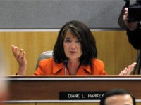 Diane-Harkey-hands-out-ap Assemblywoman Diane Harkey, R-Dana Point questions Gov. Jerry Brown about his proposed state budget during his appearance before the joint legislative budget conference committee at the Capitol in Sacramento, Calif., Thursday, Feb. 24, 2011. (AP Photo/Rich Pedroncelli)