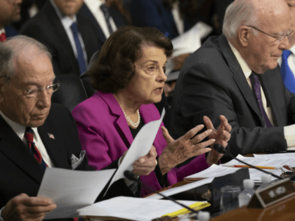 Sen. Dianne Feinstein, D-Calif., the ranking member on the Senate Judiciary Committee, flanked by Chairman Chuck Grassley, R-Iowa, left, and Sen. Patrick Leahy, D-Vt., right, makes an opening statement at the confirmation hearing of President Donald Trump's Supreme Court nominee, Brett Kavanaugh, on Capitol Hill in Washington, Tuesday, Sept. 4, …