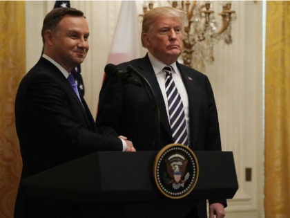 U.S. President Donald Trump (R) and Polish President Andrzej Sebastian Duda shake hands during a joint news conference at the East Room of the White House September 18, 2018 in Washington, DC. While Trump made Poland the first stop on his European tour last year, Duda is on his first …