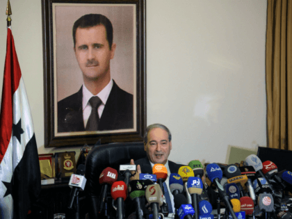 This photo released by the Syrian official news agency SANA, Syrian Deputy Foreign Minister Faisal Mekdad, speaks during a news conference in Damascus, Syria, Saturday, March 10, 2018. Mekdad denied opposition charges that government forces used poison gas in their attacks on eastern Ghouta. Mekdad added that insurgents groups in …
