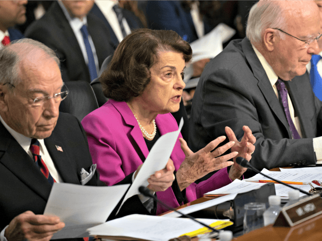 Senate Supreme Court Sen. Dianne Feinstein, D-Calif., the ranking member on the Senate Judiciary Committee, flanked by Chairman Chuck Grassley, R-Iowa, left, and Sen. Patrick Leahy, D-Vt., right, makes an opening statement at the confirmation hearing of President Donald Trump's Supreme Court nominee, Brett Kavanaugh, on Capitol Hill in Washington, …