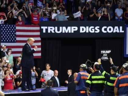 US President Donald Trump speaks during a political rally at Charleston Civic Center in Charleston, West Virginia on August 21, 2018. - Trump's administration announced a plan on August 21 to weaken regulations on US coal plants, giving a boost to an industry that former leader Barack Obama had hoped …