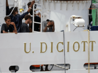 GettyImages-1021751120 Migrants gather on the deck of the Italian Coast Guard vessel 'Diciotti' in the Sicilian port of Catania, on August 23, 2018, as they wait to disembark following a rescue operation at sea. - The Diciotti vessel rescued the migrants six days ago but Italy's far-right Interior Minister Matteo Salvini …
