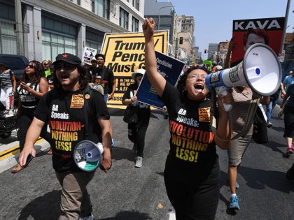 Demonstrators march through the city streets during the 'Unite For Justice' rally in protest of judge Brett Kavanaugh's confirmation to the US Supreme Court, in Los Angeles, California on August 26, 2018. (Photo by Mark RALSTON / AFP) (Photo credit should read MARK RALSTON/AFP/Getty Images)