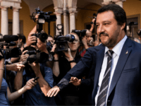 Italy's Interior Minister Matteo Salvini (R) looks on as he walks among media representatives before the arrival of Hungary's Prime Minister Viktor Orban, ahead of a meeting in Milan on August 28, 2018. (Photo by MARCO BERTORELLO / AFP) (Photo credit should read MARCO BERTORELLO/AFP/Getty Images)